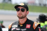 Chase Briscoe, driver of the #19 Bass Pro Shops Toyota, looks on during qualifying for the NASCAR Cup Series Iowa Corn 350- Qualifying - Source: Getty